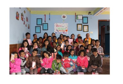 1487758745H9-employees-with-Prayas-Nepal-kids.jpg